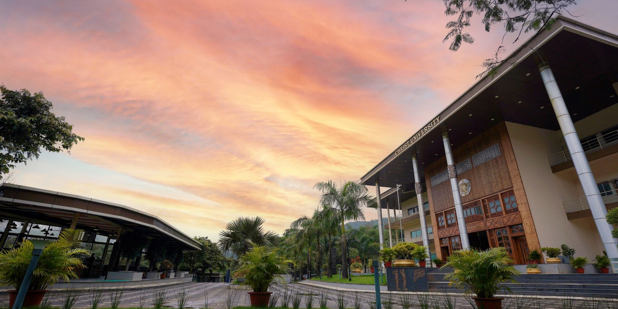CHRIST (Deemed to be University), Pune Lavasa Campus: the academic block and the graduates sculpture at its entrance