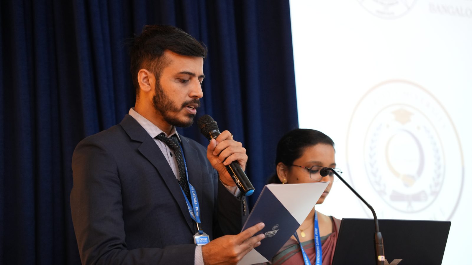 An alumnus addressing the gathering at the 10-Year Campus Celebration, Alumni Meet 2025