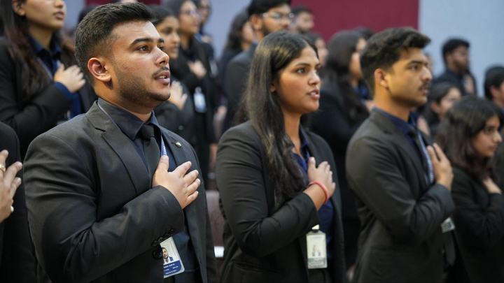 Council members and students during the pledge at the Valedictory Ceremony