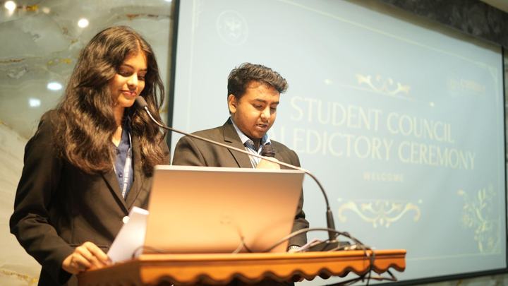 Student representatives welcoming guests to the Student Council Valedictory Ceremony