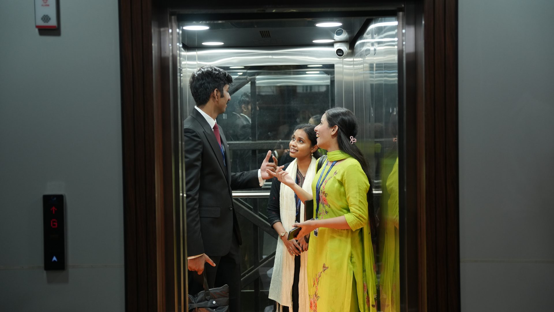 Students and staff using the lift in an academic building at CHRIST Lavasa